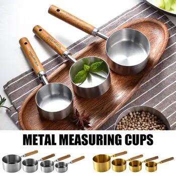 Набор от размерите чашки с прозрачна мащаб, мерителни лъжици от неръждаема стомана, мерителна кана и чаша за измерване на храна в кухнята на хотела